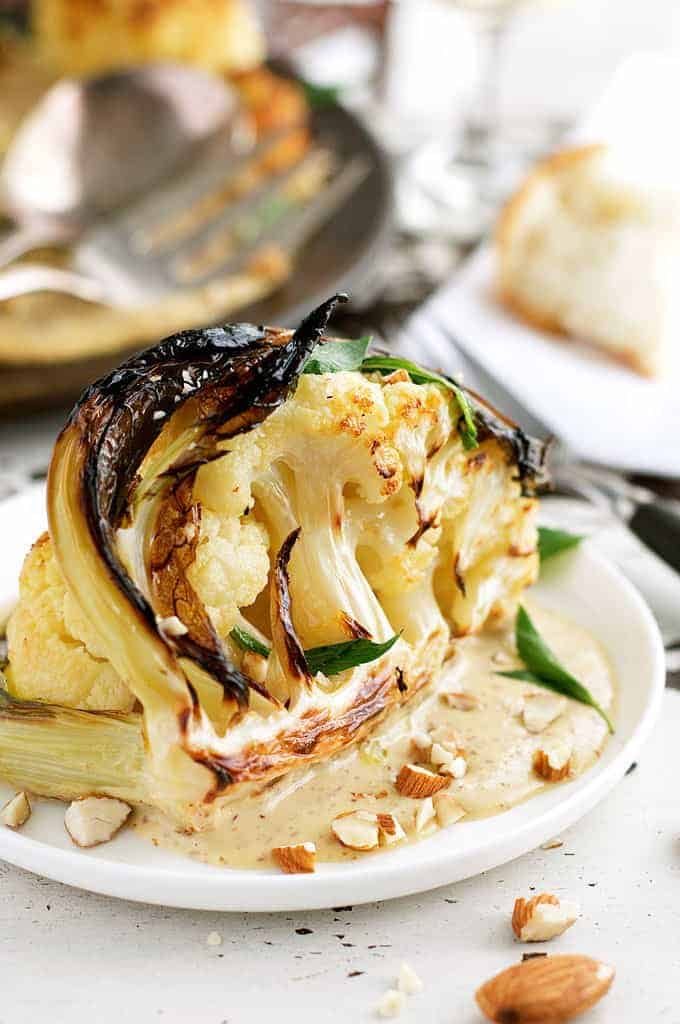Ester's Roasted Cauliflower with Almond Sauce on a white plate
