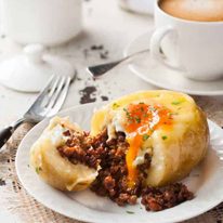 Sausage and Egg Breakfast Potato Skins cut open showing insides