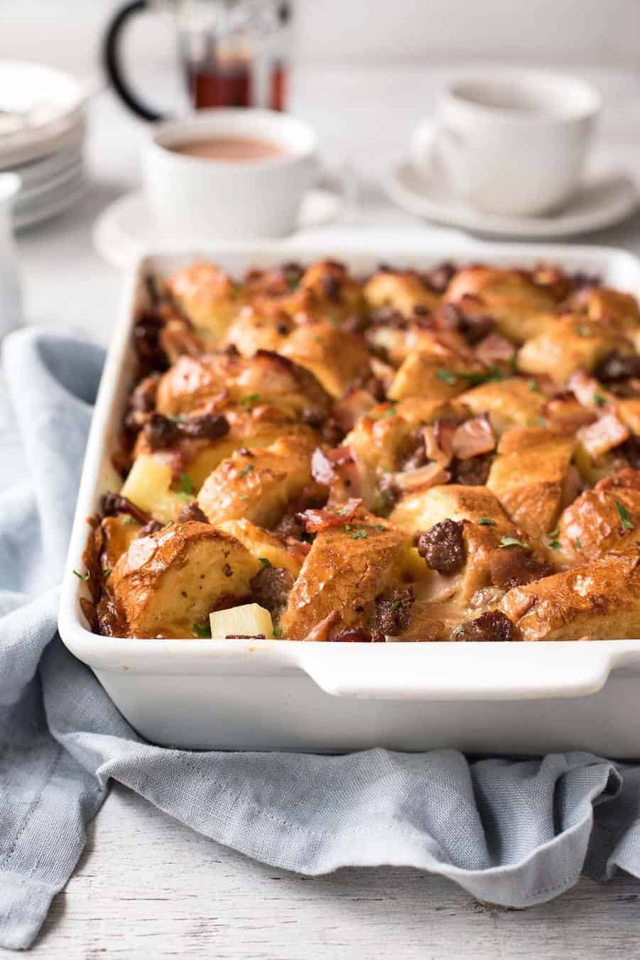 Sausage and Bacon Country Breakfast Casserole in a white dish, ready to be served.