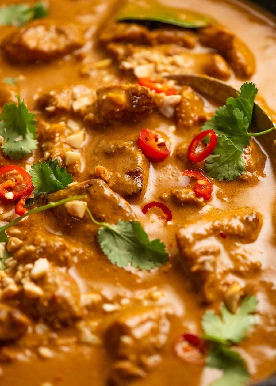 Close up of Chicken Satay Curry (Malaysian) in a skillet, fresh off the stove