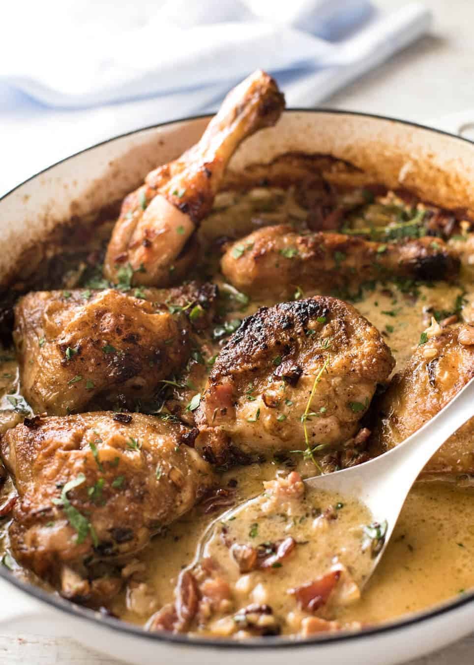 Chicken with Creamy White Wine Sauce and Bacon - So easy to prepare, then just let it braise in the oven until the chicken is tender. The sauce is incredible! www.recipetineats.com