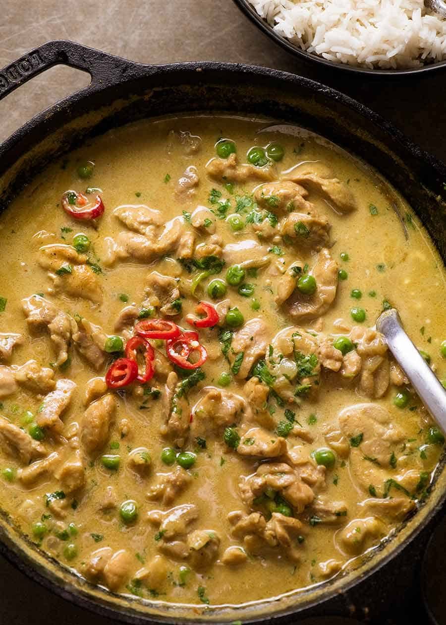 Overhead photo of Chicken Curry in a black skillet, fresh off the stove