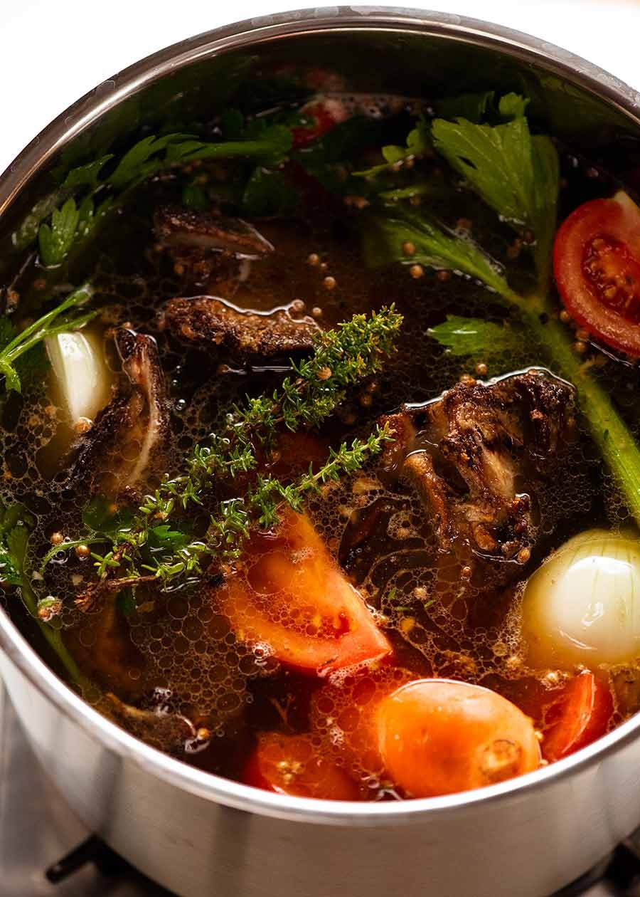 Pot of beef stock simmering